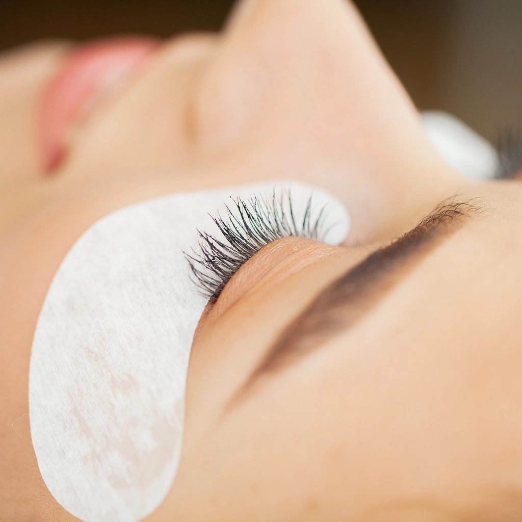 Close-up of lash extensions being applied