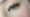 A woman with brown and green eyes with volume eyelash extensions. The make up is very natural and the eyelashes are prominent and full. These are volume eyelash extensions.