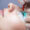A close up of a women having eyelash extensions applied.