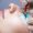 A close up of a women having eyelash extensions applied.