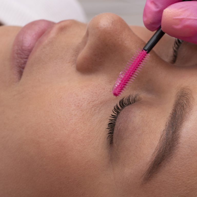 hand-with-glove-holding-brush-si